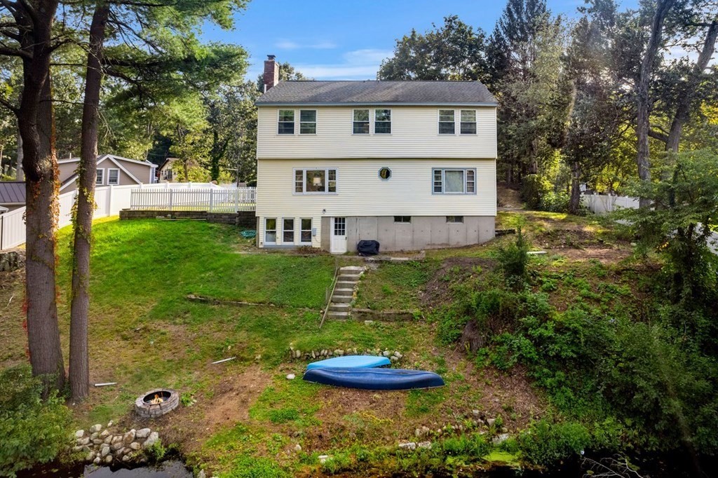 22 Fosters Pond Road Andover, MA 01810 - Photo 36 of 42 a front view of a house with a yard