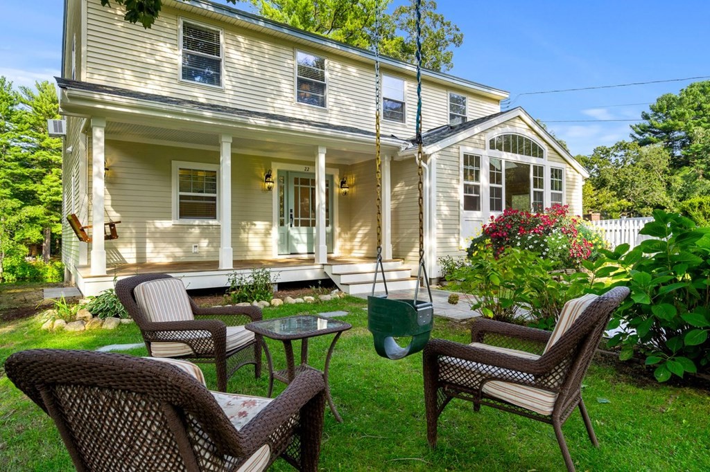 22 Fosters Pond Road Andover, MA 01810 - Photo 4 of 42 a front view of a house with a garden and patio