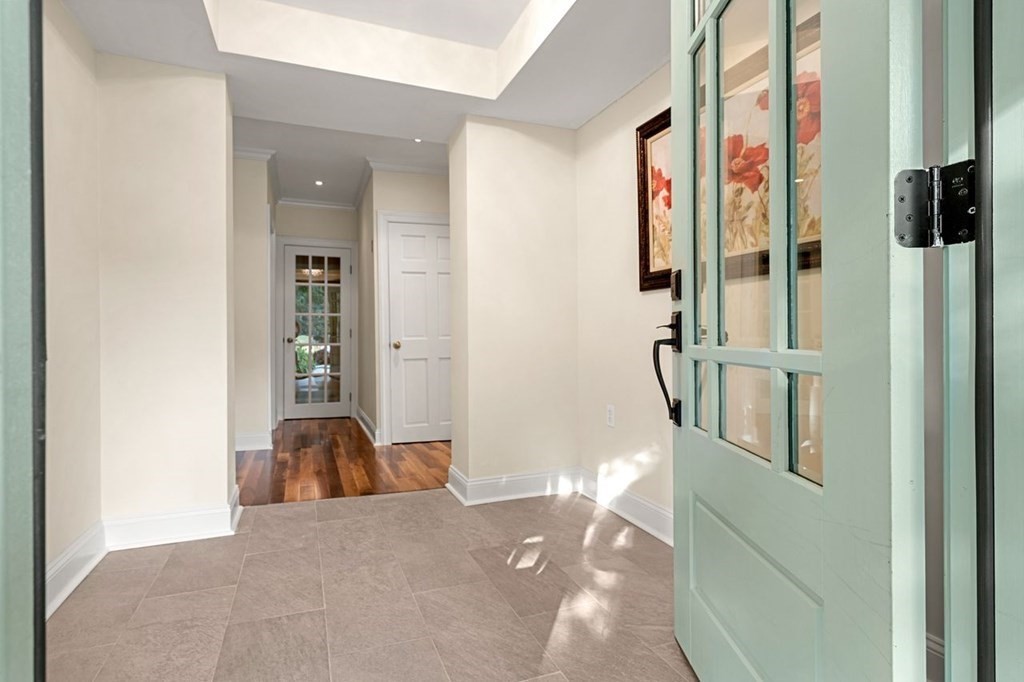 22 Fosters Pond Road Andover, MA 01810 - Photo 6 of 42 a view of a bedroom with wooden floor and windows