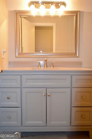 a white toilet sitting next to a white curtain