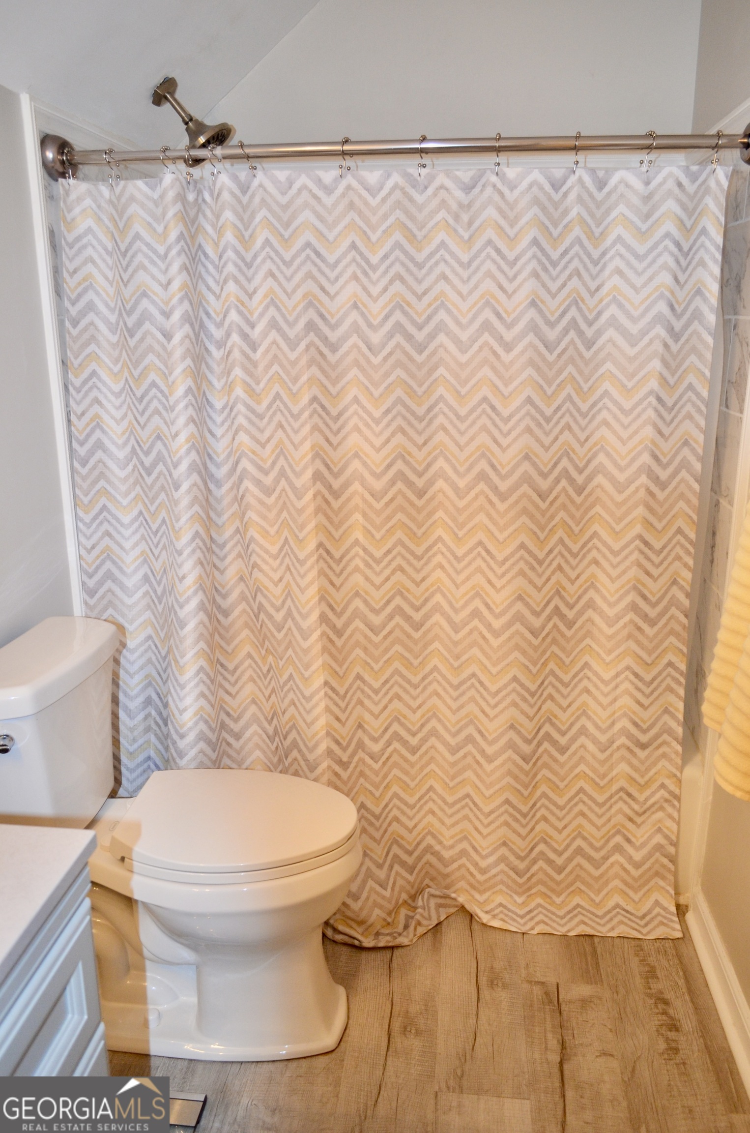 116 Elk Run Warner Robins, GA 31088 - Photo 16 of 43 a white toilet sitting next to a white curtain