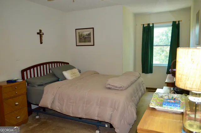 a bedroom with a bed and a mirror