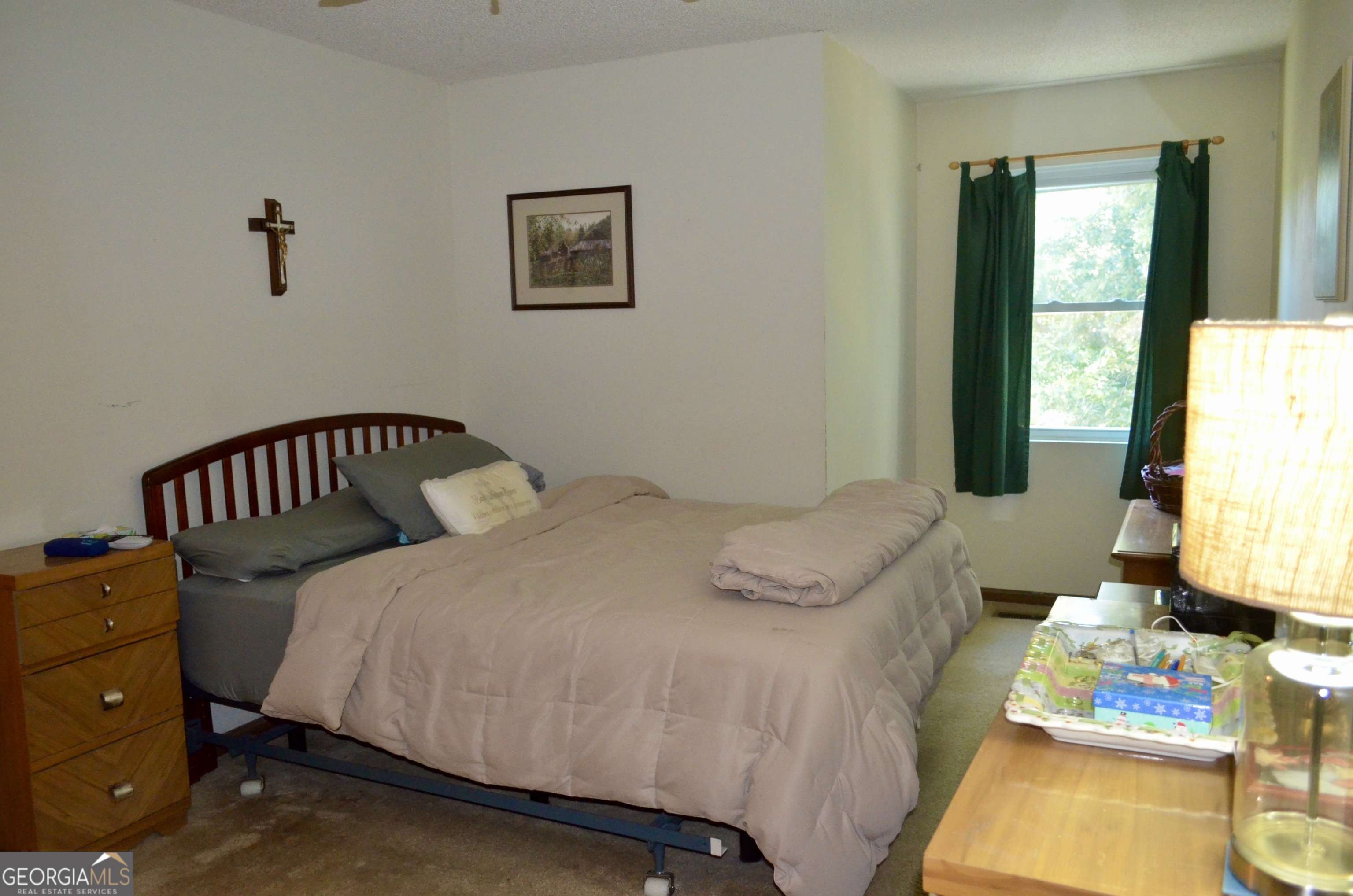 116 Elk Run Warner Robins, GA 31088 - Photo 18 of 43 a bedroom with a bed and a window
