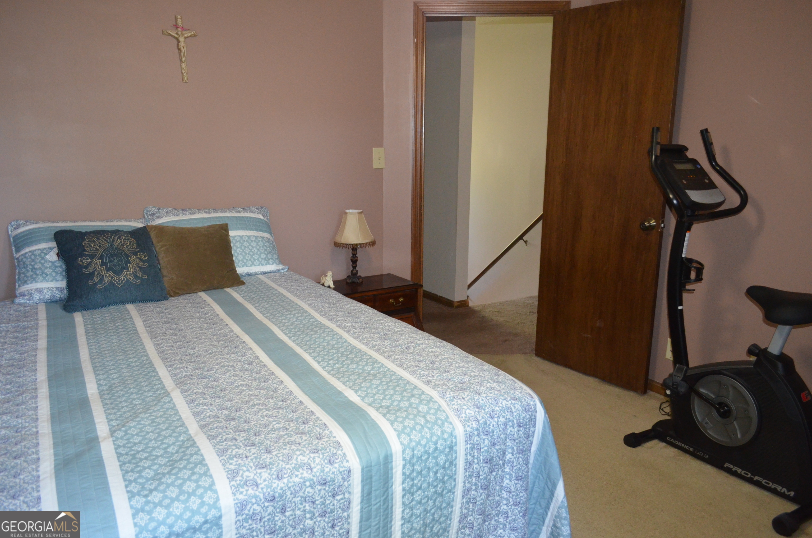 116 Elk Run Warner Robins, GA 31088 - Photo 22 of 43 a bedroom with a bed and gym equipment