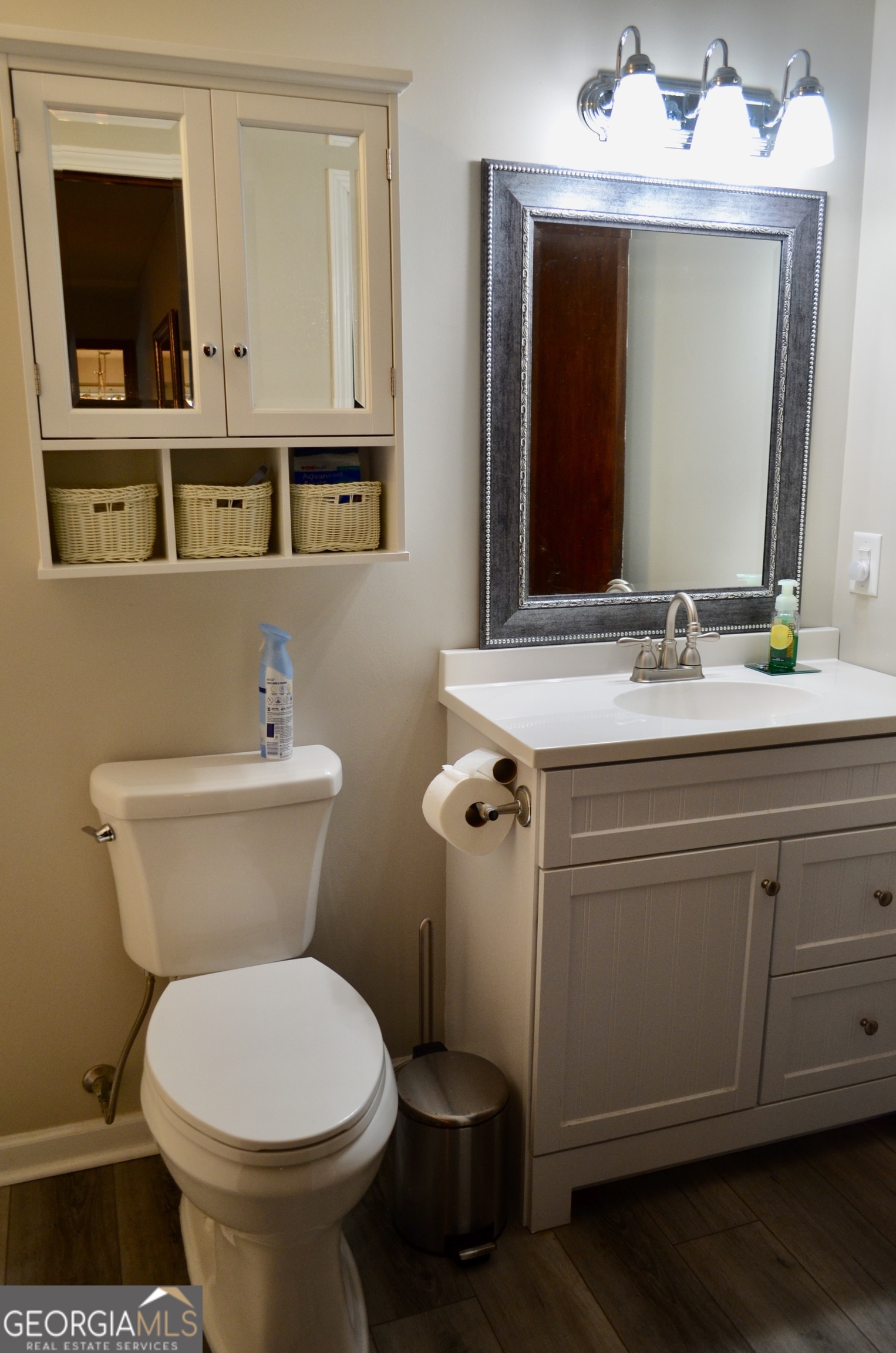 116 Elk Run Warner Robins, GA 31088 - Photo 33 of 43 a bathroom with a toilet sink and mirror