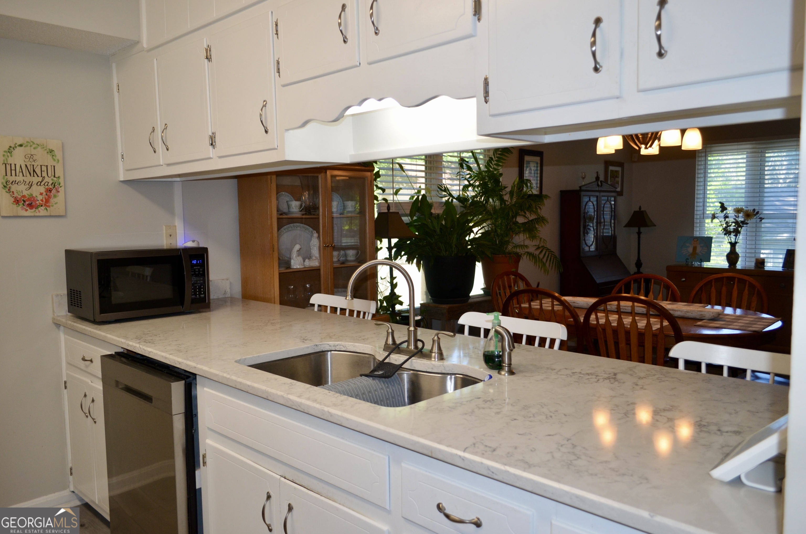 116 Elk Run Warner Robins, GA 31088 - Photo 4 of 43 a kitchen with stainless steel appliances a sink a stove and cabinets