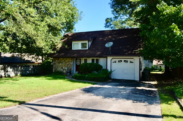 a front view of a house with garden