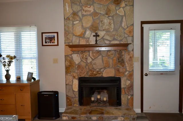 a living room with a fireplace