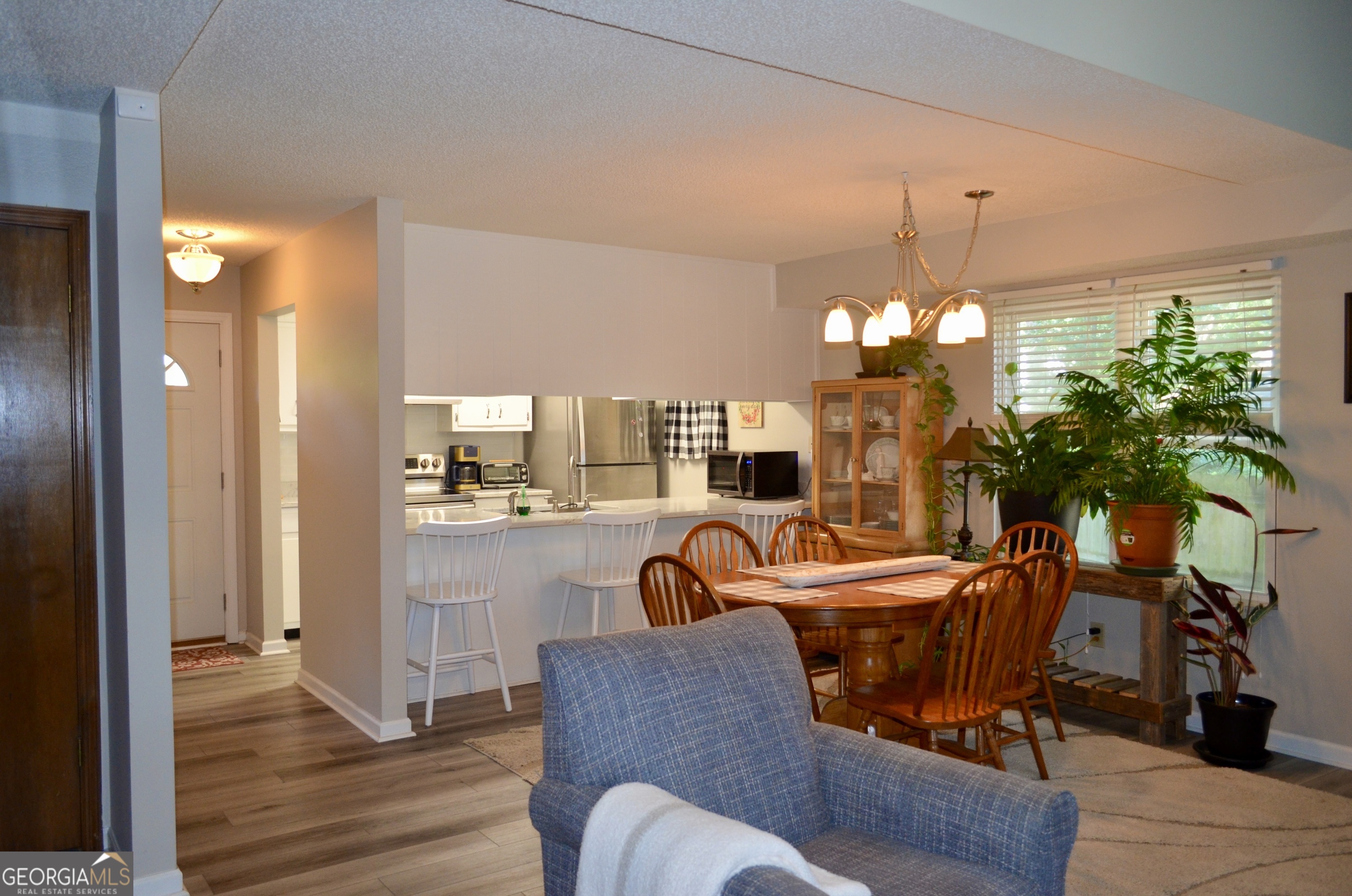 116 Elk Run Warner Robins, GA 31088 - Photo 10 of 43 a view of a dining room with furniture and chandelier