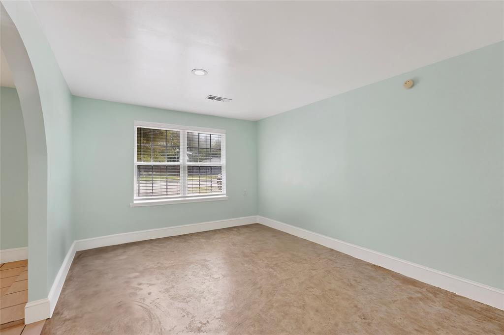 409 Dewitt Street Wilmer, TX 75172 - Photo 4 of 15 a view of an empty room with a window