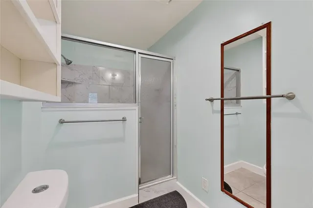 a view of hallway with mirror