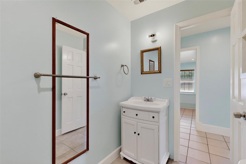 409 Dewitt Street Wilmer, TX 75172 - Photo 8 of 15 a view of hallway with mirror