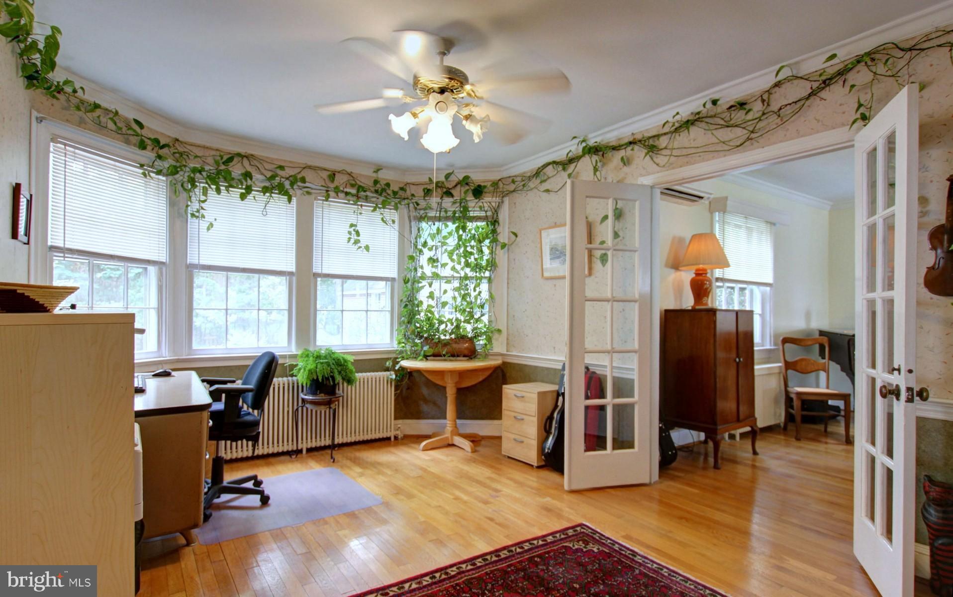 currently a home office with huge bow window