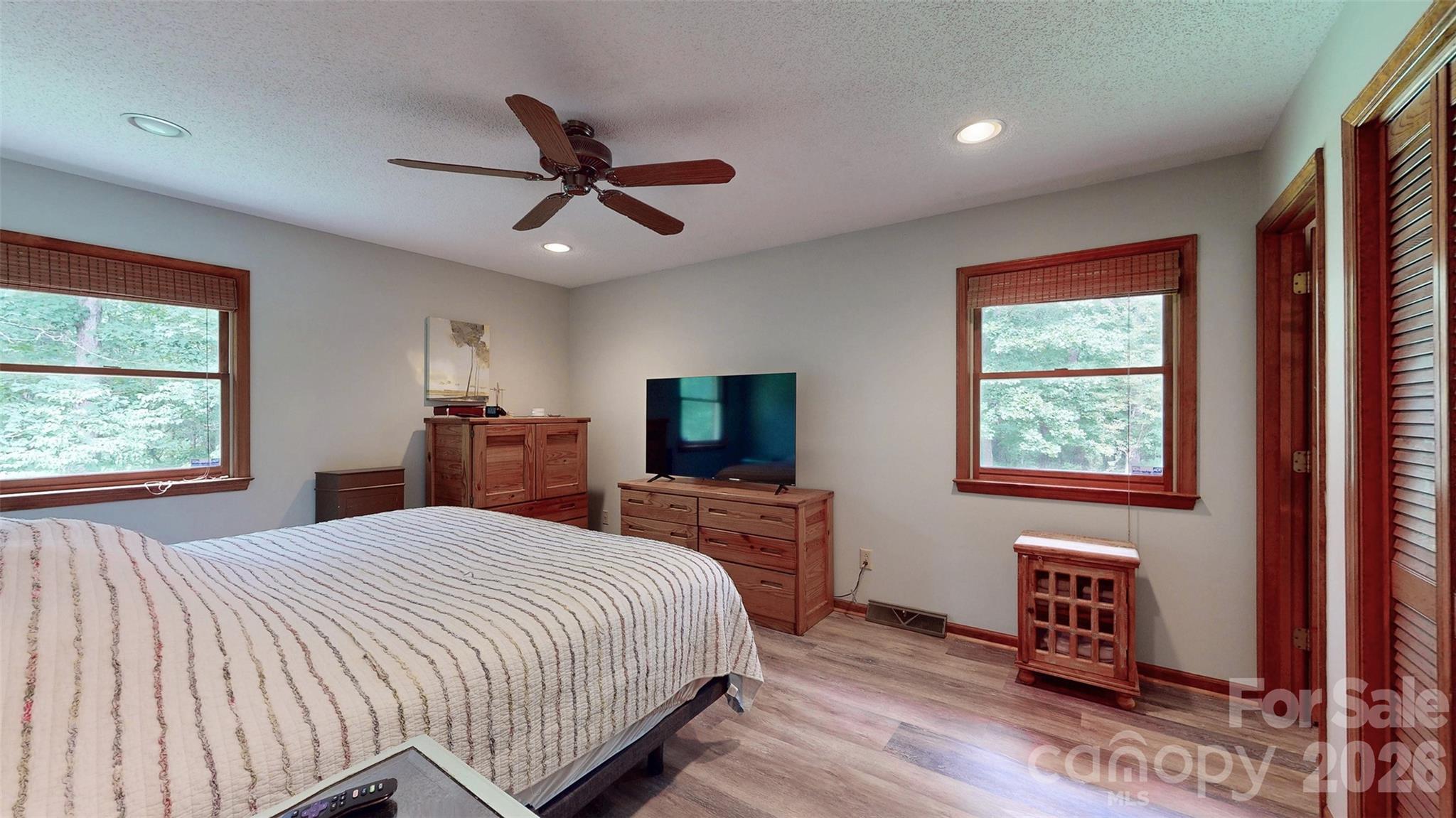 8720 Unionville-Brief Road Monroe, NC 28110 - Photo 32 of 35 a bedroom with a bed and a flat screen tv