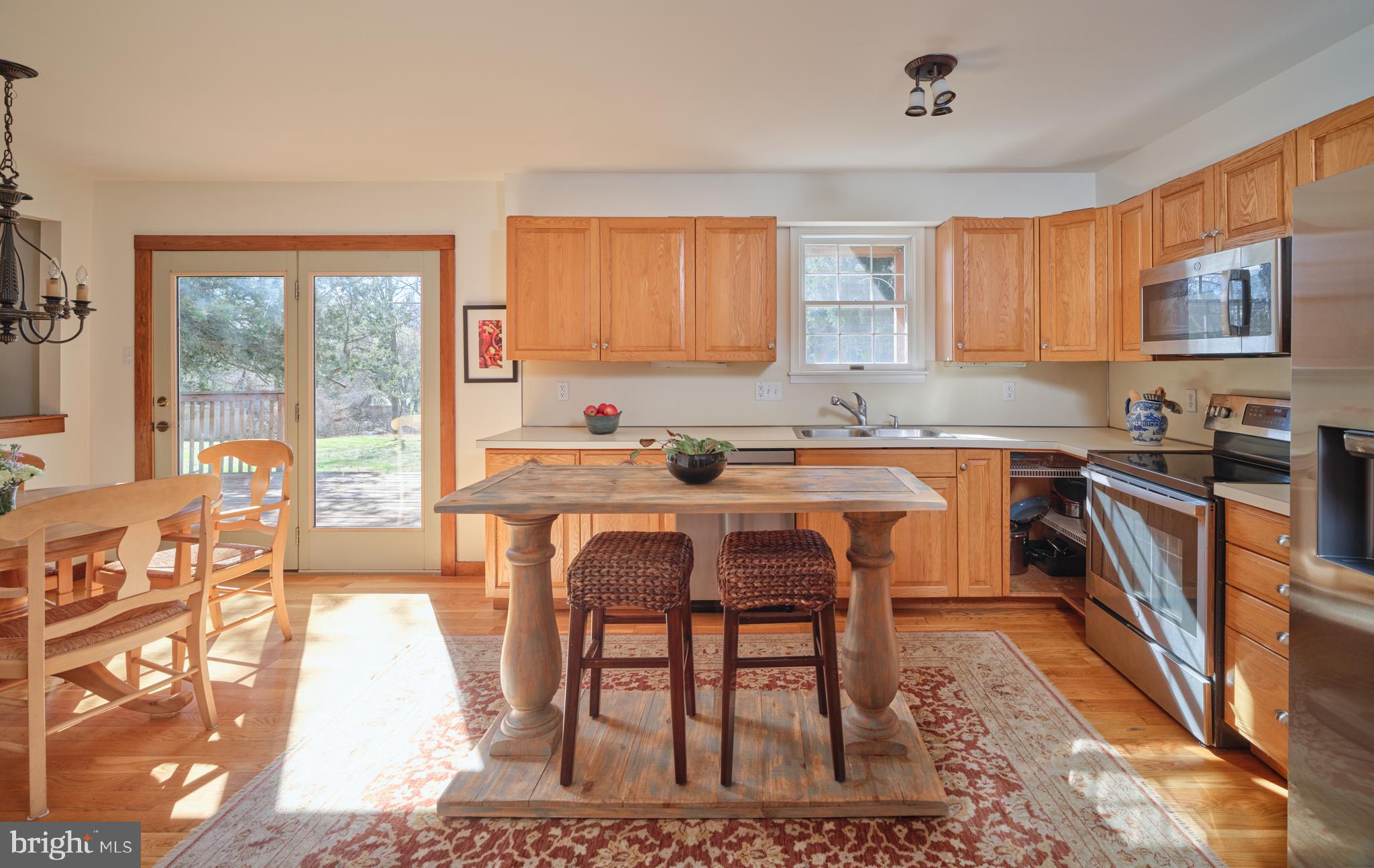 6724 Upper York Road New Hope, PA 18938 - Photo 11 of 40 a kitchen with stainless steel appliances granite countertop a stove a sink dishwasher and cabinets with wooden floor