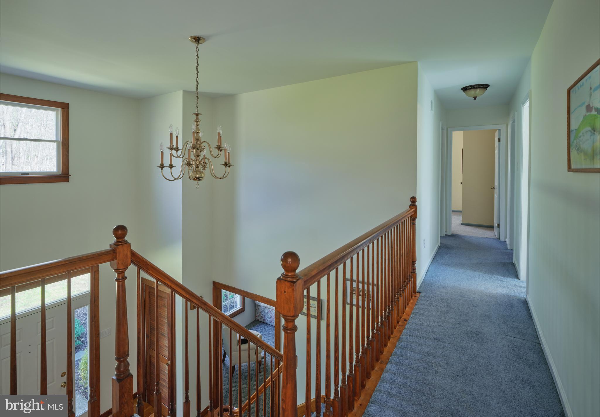 6724 Upper York Road New Hope, PA 18938 - Photo 29 of 40 a view of a hallway with a chandelier