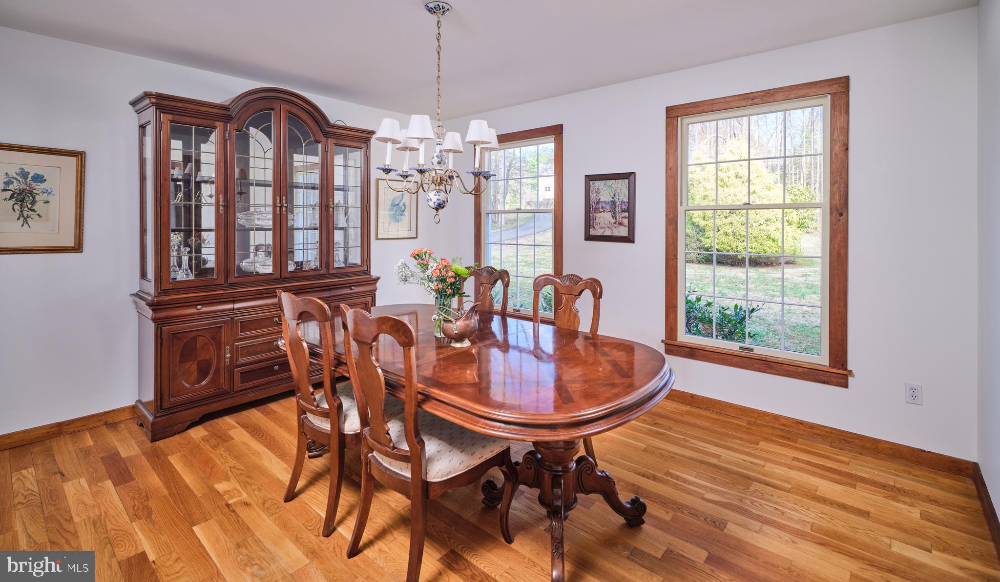 6724 Upper York Road New Hope, PA 18938 - Photo 8 of 40 a dining room with furniture a chandelier and wooden floor