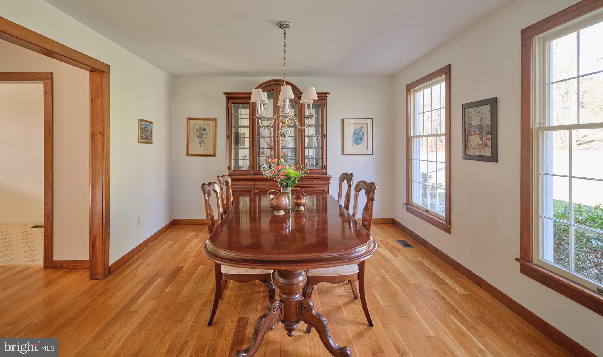 6724 Upper York Road New Hope, PA 18938 - Photo 10 of 40 a view of a dining room with furniture window and wooden floor