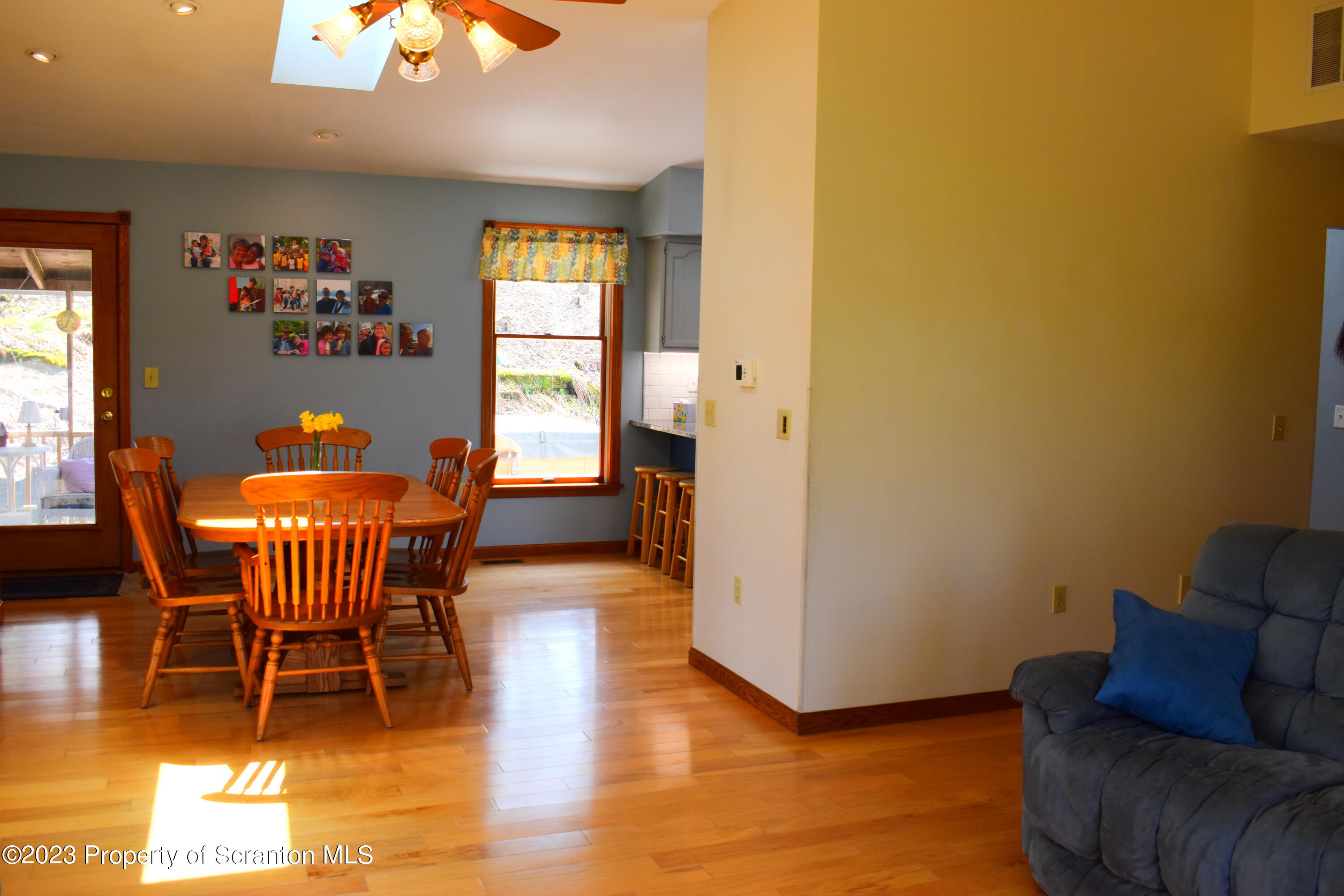 510 Hawranick Road Brackney, PA 18812 - Photo 17 of 76 a dining room with furniture a chandelier and wooden floor