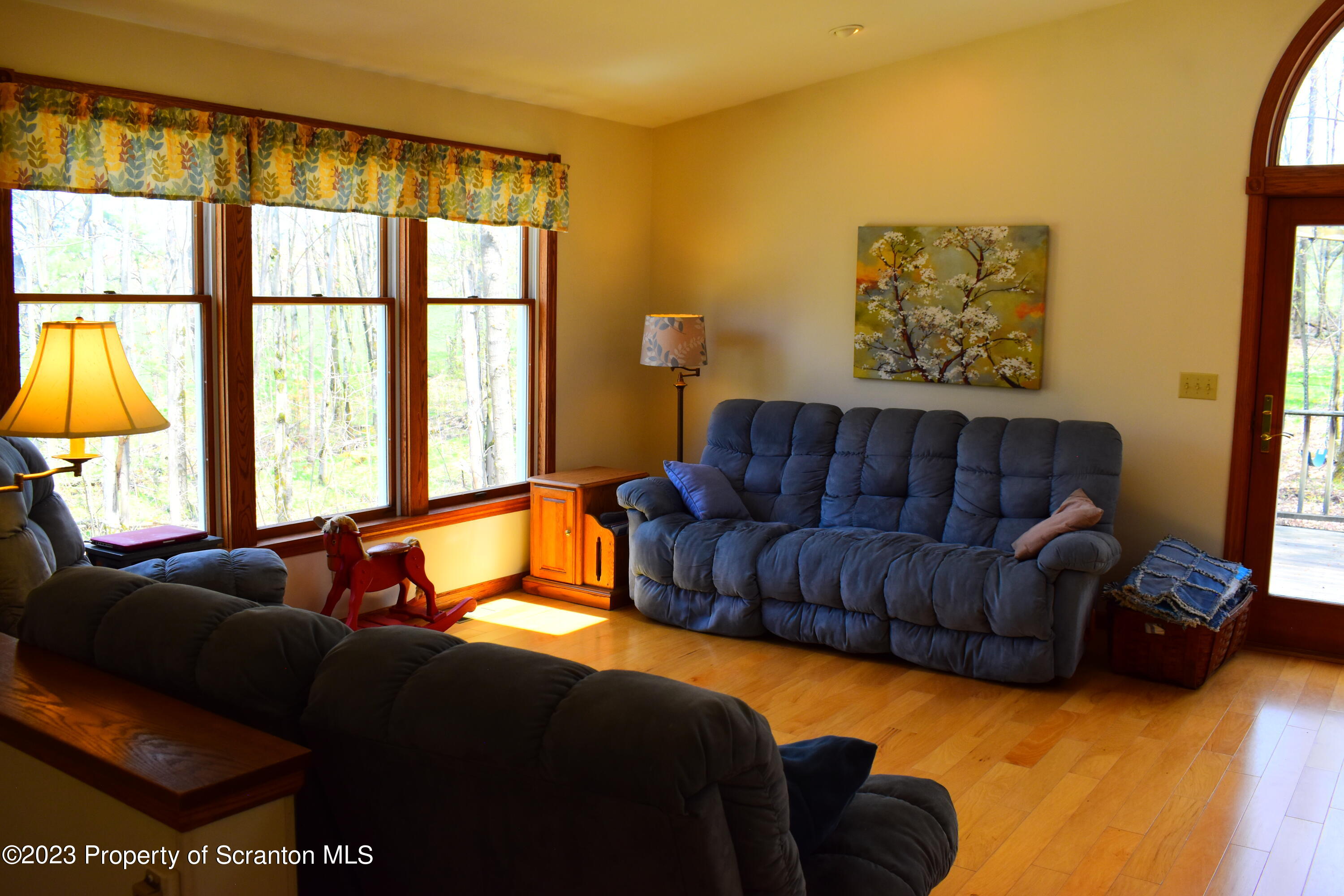 510 Hawranick Road Brackney, PA 18812 - Photo 19 of 76 a living room with a bed couch and a large window
