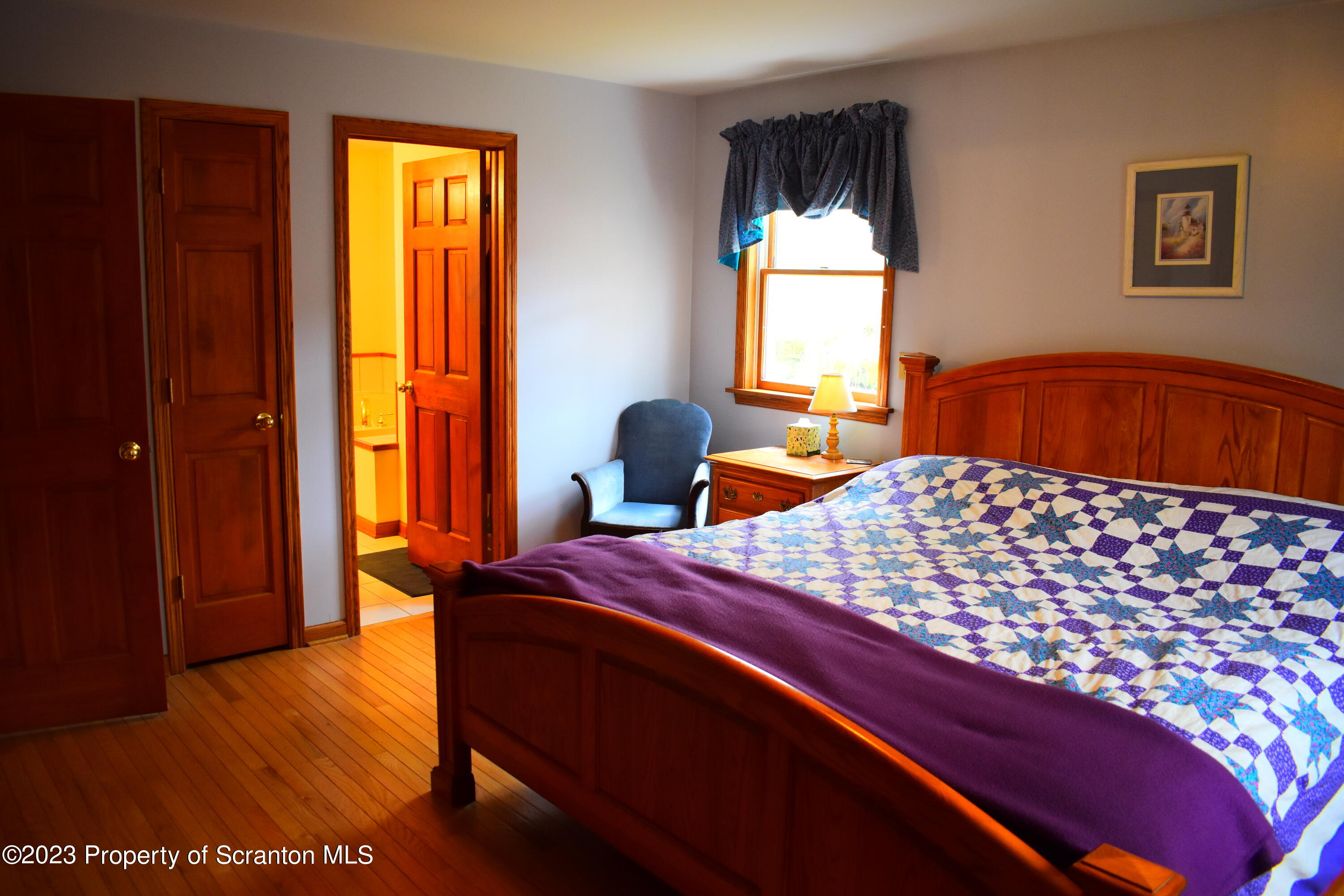 510 Hawranick Road Brackney, PA 18812 - Photo 27 of 76 a bedroom with a bed and wooden floor
