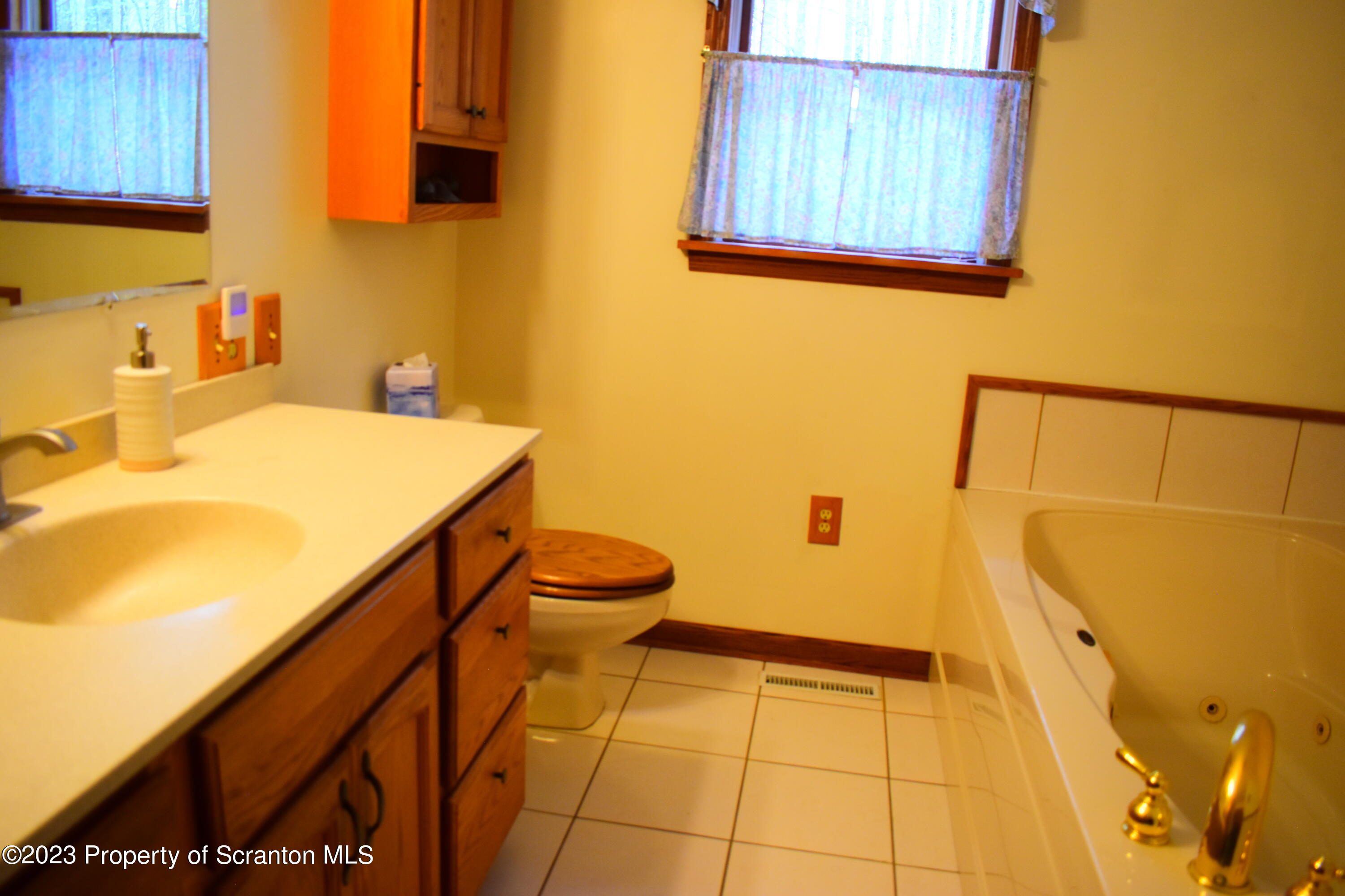 510 Hawranick Road Brackney, PA 18812 - Photo 28 of 76 a bathroom with a sink and a mirror
