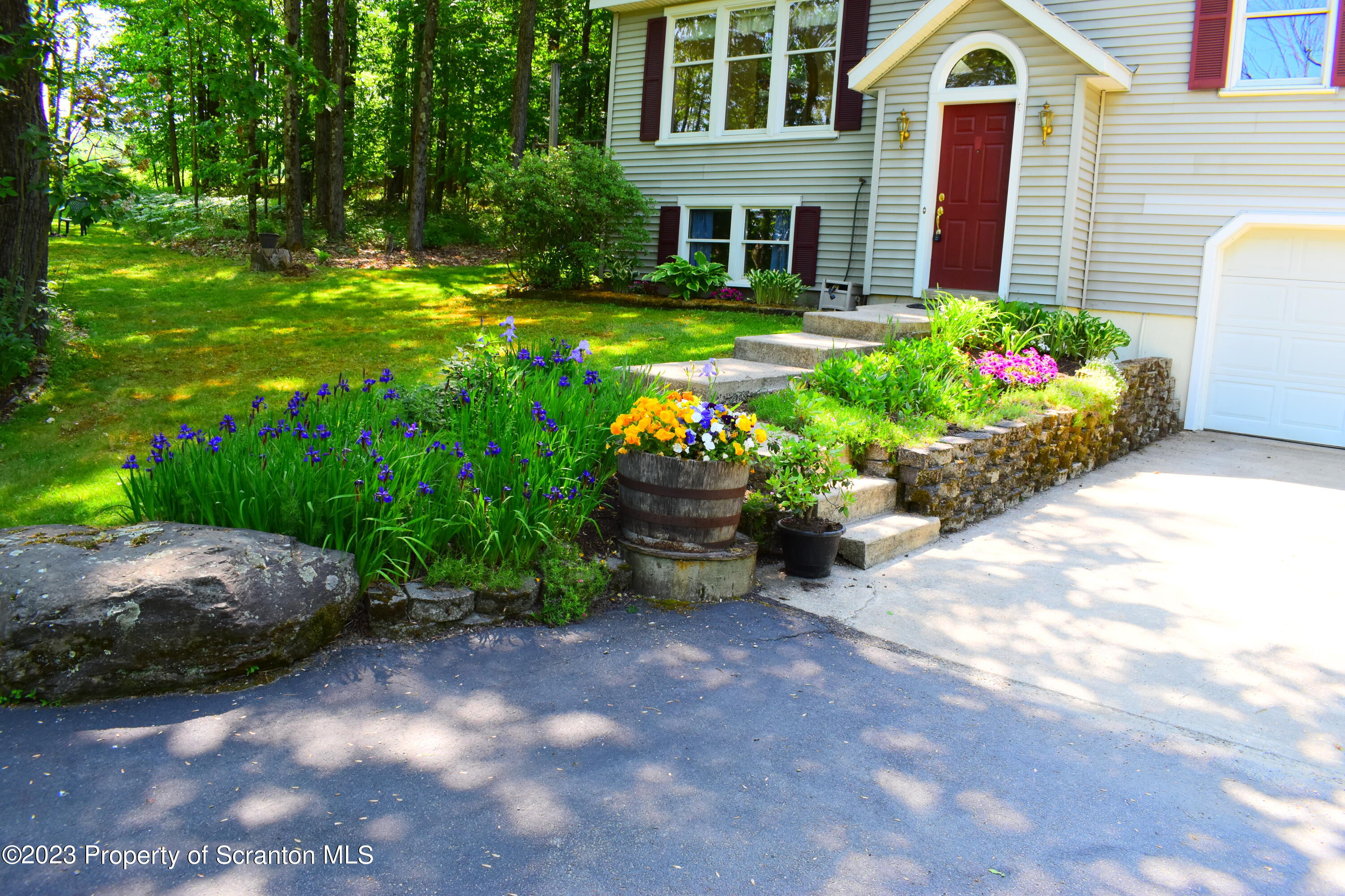 510 Hawranick Road Brackney, PA 18812 - Photo 4 of 76 a backyard of a house with a yard and outdoor seating