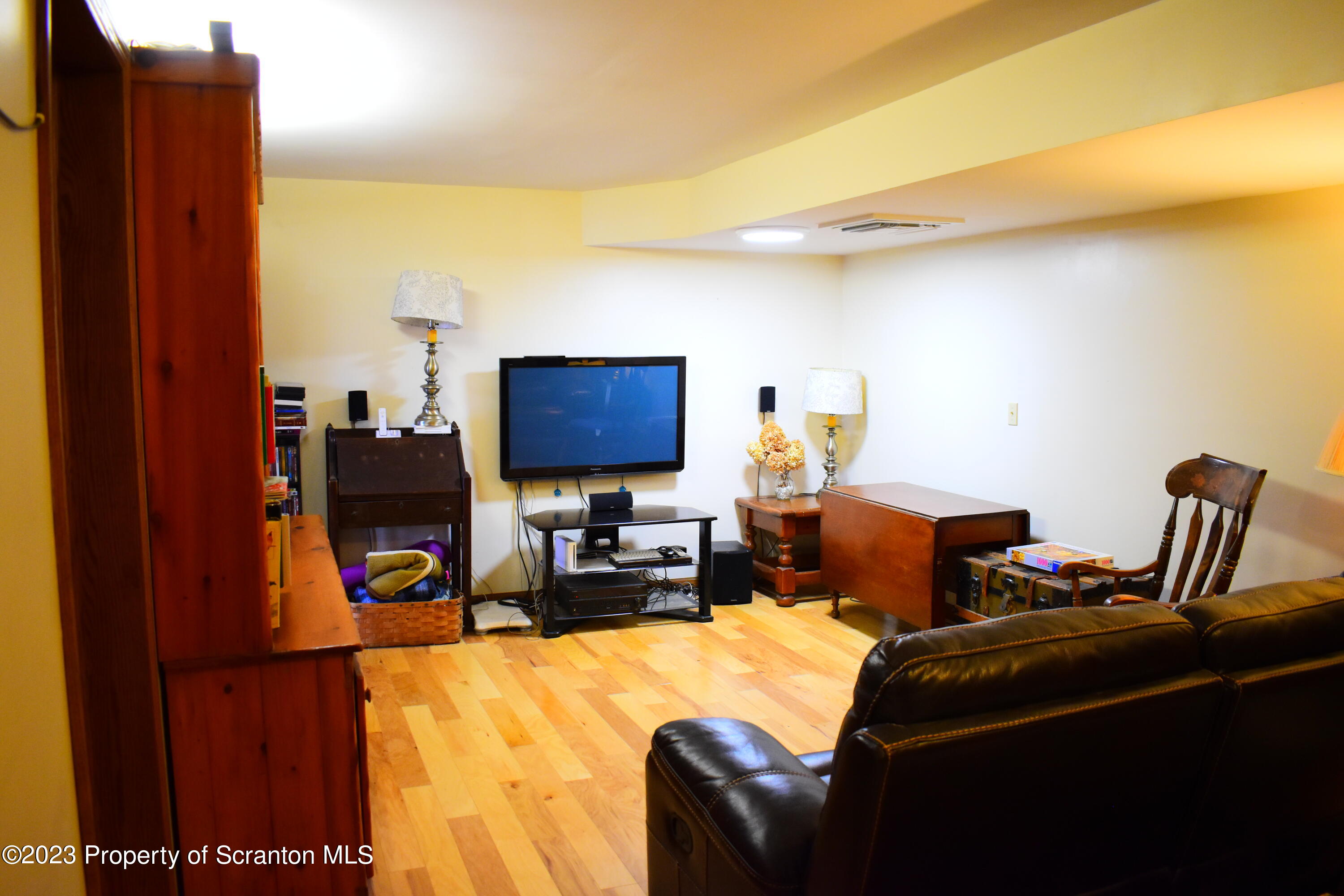 510 Hawranick Road Brackney, PA 18812 - Photo 43 of 76 a living room with furniture a flat screen tv and a refrigerator