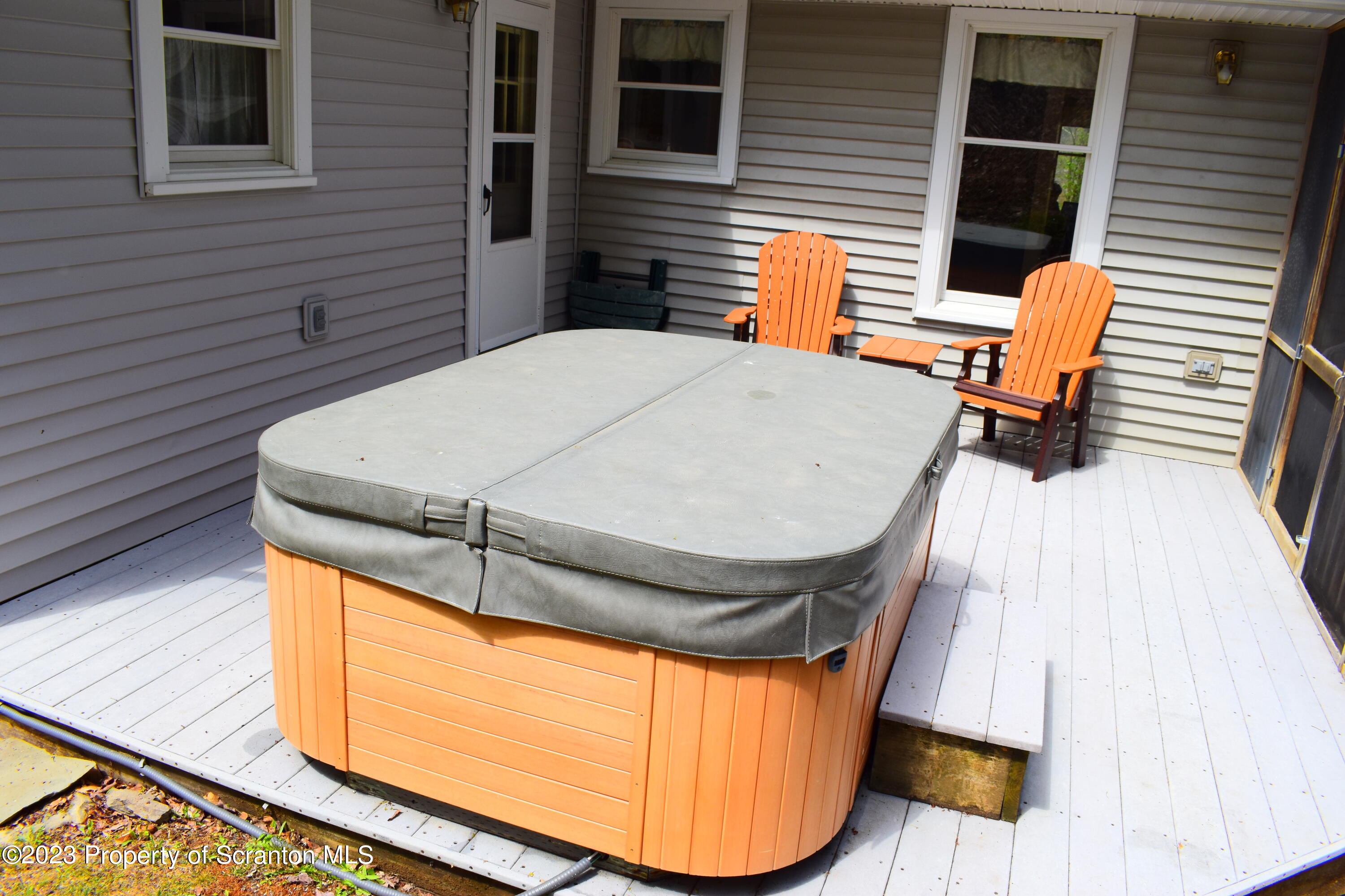 510 Hawranick Road Brackney, PA 18812 - Photo 54 of 76 a backyard of a house with wooden floor and outdoor seating