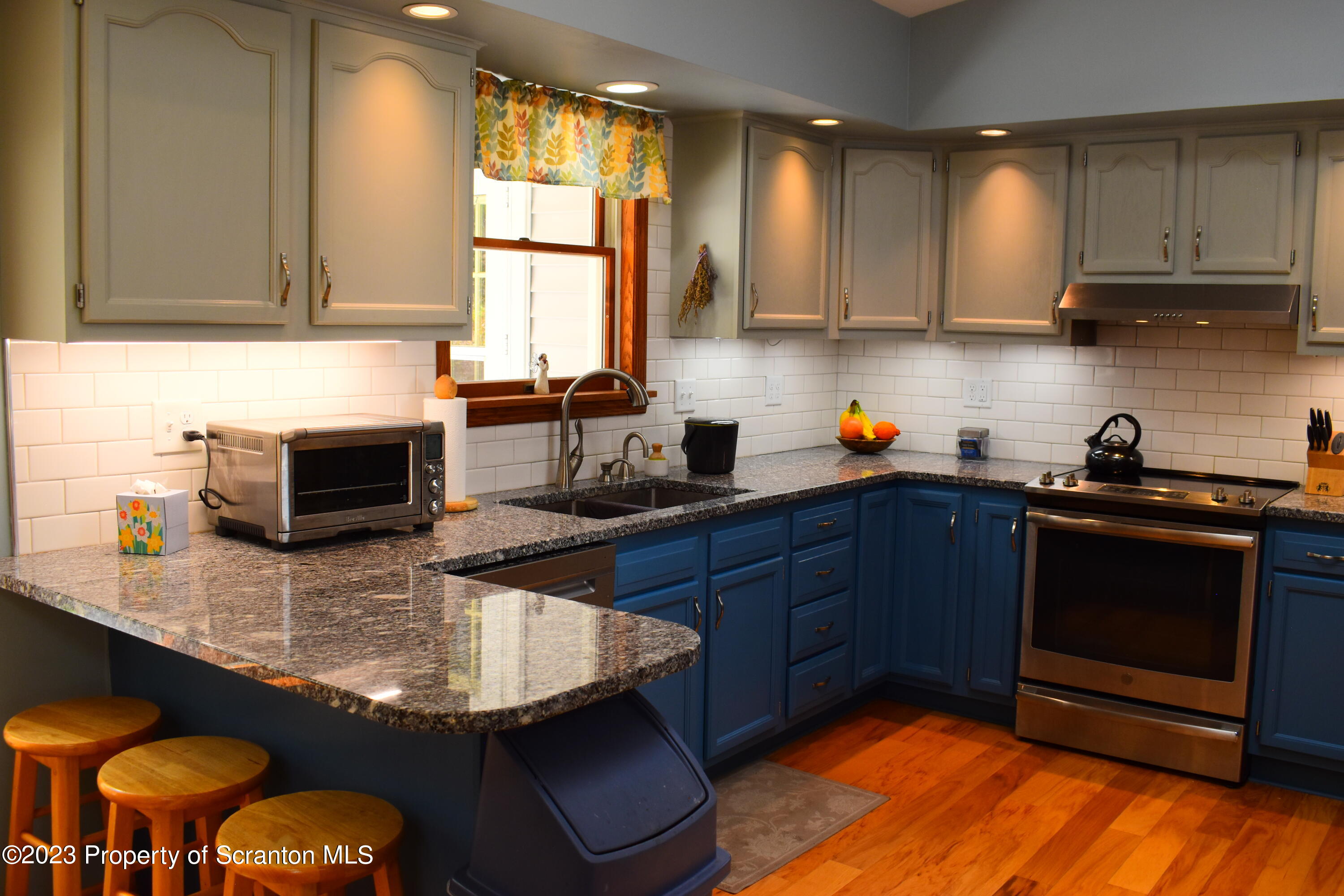 510 Hawranick Road Brackney, PA 18812 - Photo 7 of 76 a kitchen with stainless steel appliances granite countertop a sink a stove counter space and cabinets