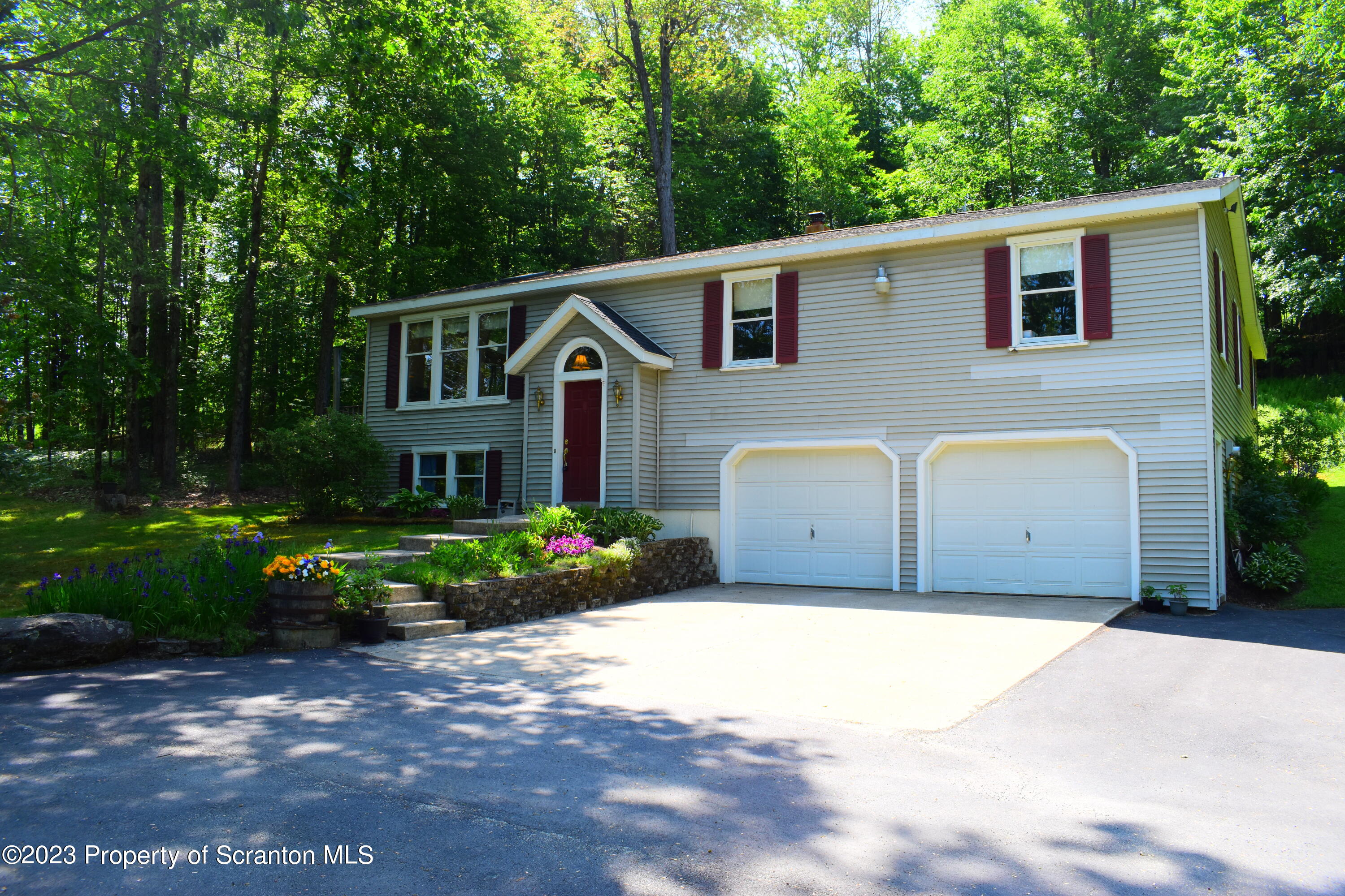 510 Hawranick Road Brackney, PA 18812 - Photo 72 of 76 a front view of a house with a garden