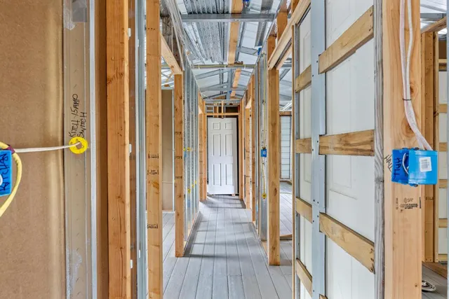a view of an entryway with a table and chairs