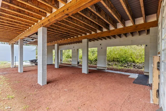 front view of a house with a backyard