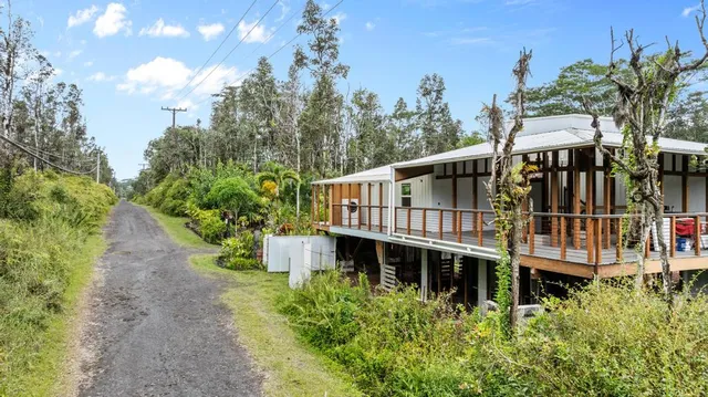 an aerial view of a house with a garden