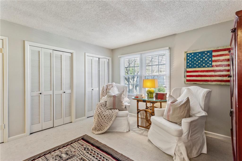 162 Lablanc Way Northwest Atlanta, GA 30327 - Photo 16 of 22 a living room with furniture and a lamp
