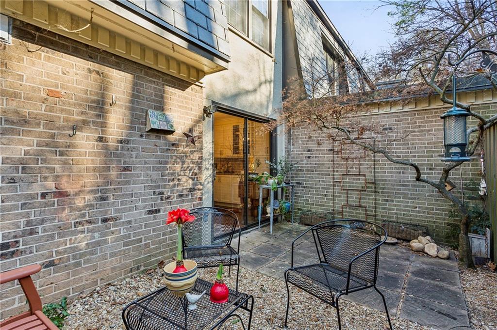 162 Lablanc Way Northwest Atlanta, GA 30327 - Photo 22 of 22 a backyard of a building with barbeque oven table and chairs