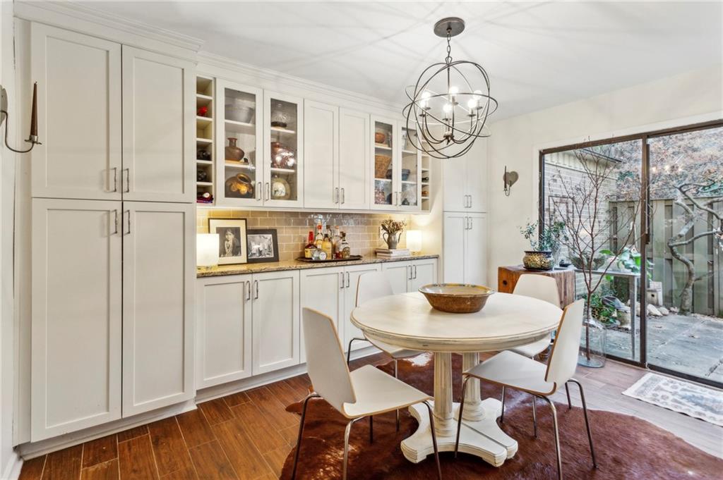 162 Lablanc Way Northwest Atlanta, GA 30327 - Photo 8 of 22 a view of a dining room with furniture window and wooden floor