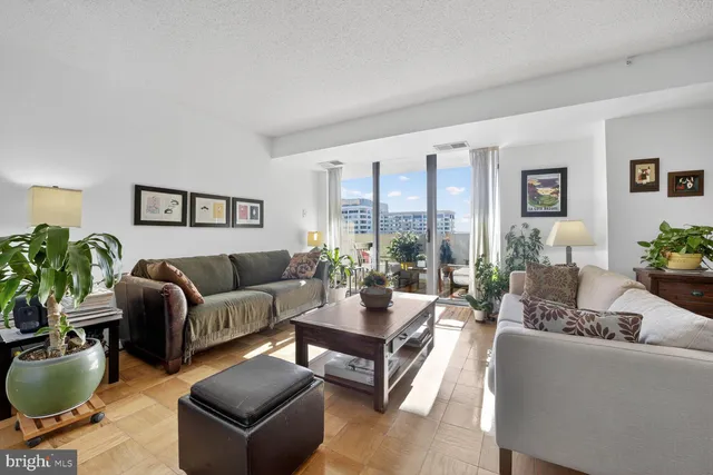 a hallway with sink and wooden floor