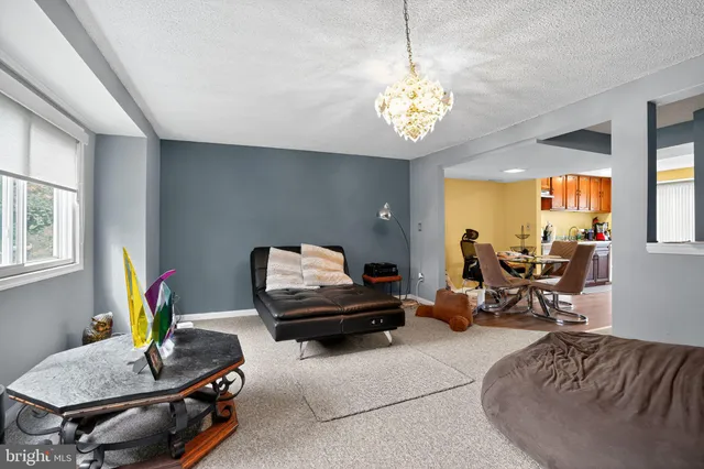 a living room with furniture and a table