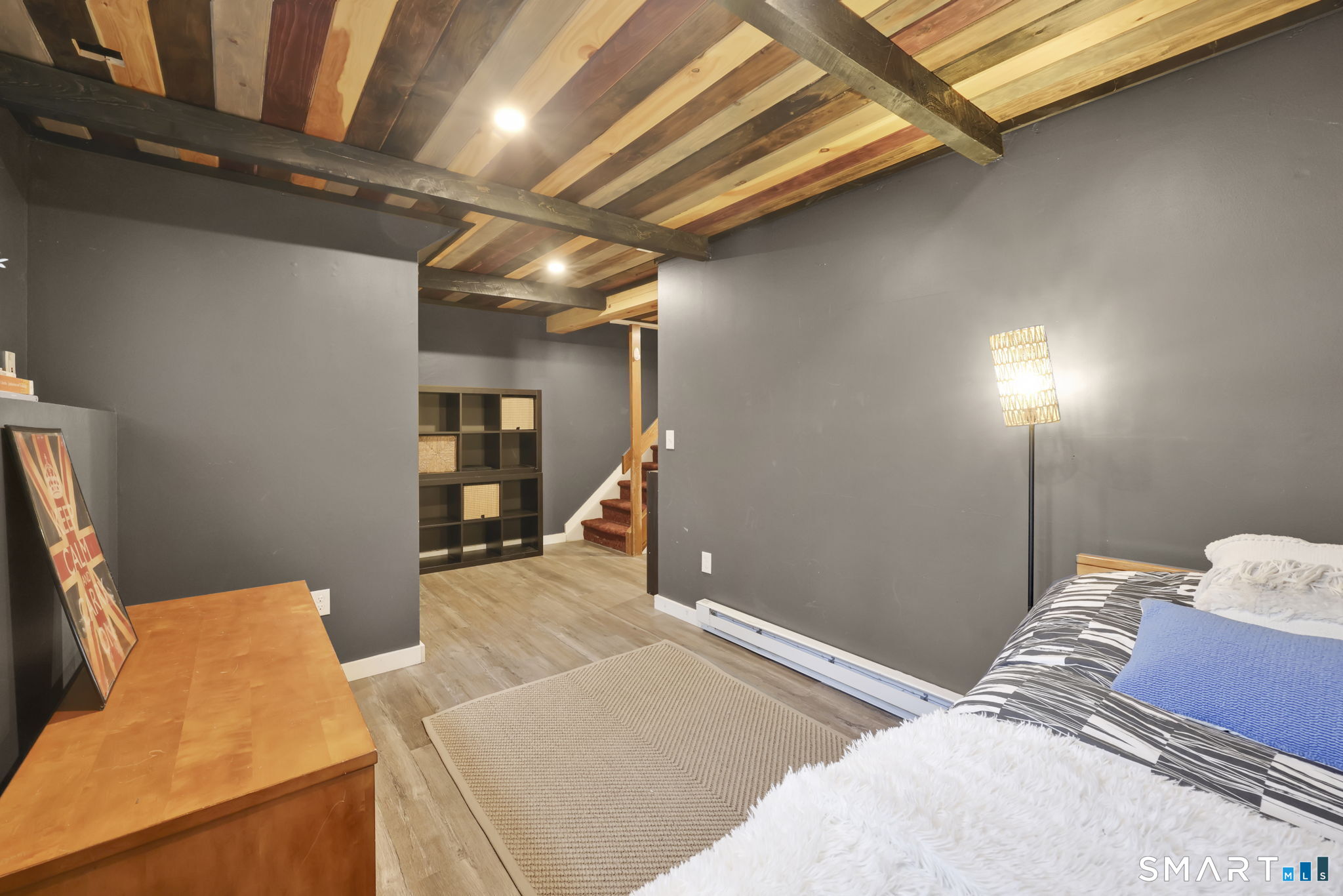 8 Whirling Dun, Unit 8 Canton, CT 06019 - Photo 19 of 28 a bedroom with a bed and wooden floor