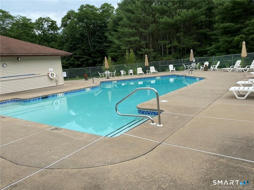 8 Whirling Dun, Unit 8 Canton, CT 06019 - Photo 27 of 28 a view of a swimming pool with a patio