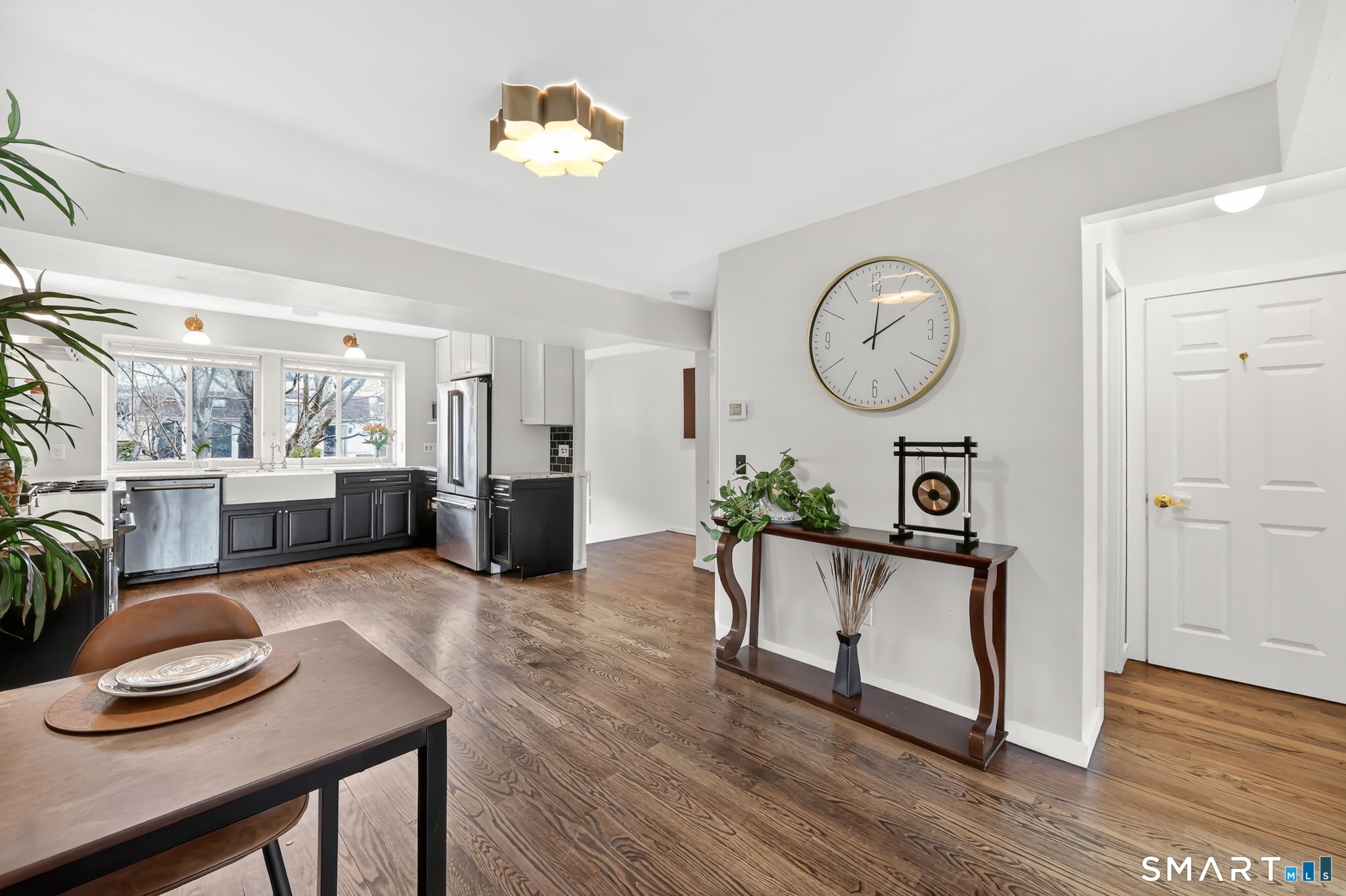 8 Whirling Dun, Unit 8 Canton, CT 06019 - Photo 7 of 28 a living room with furniture and a wooden floor