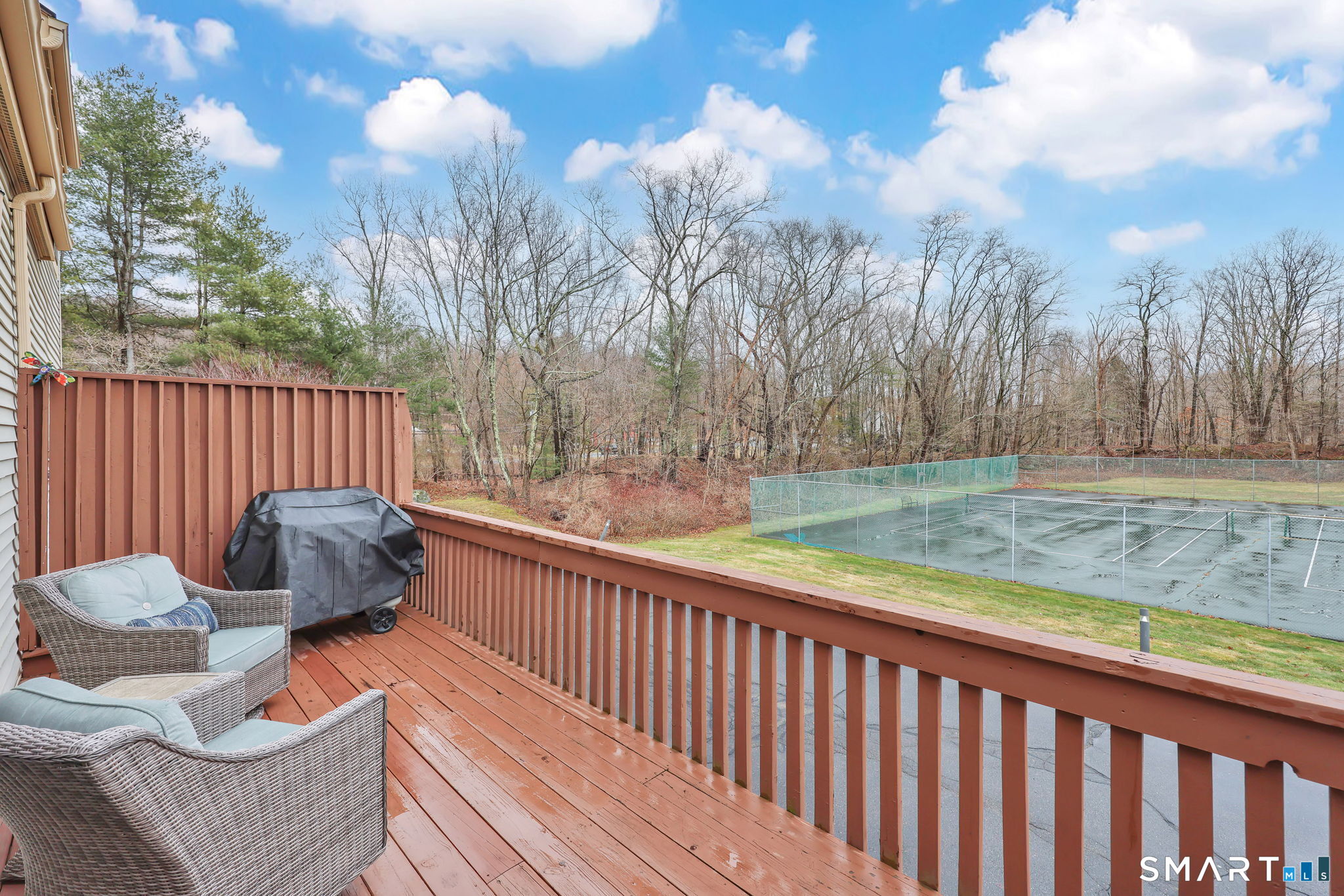 8 Whirling Dun, Unit 8 Canton, CT 06019 - Photo 9 of 28 a view of sitting area with furniture and wooden fence