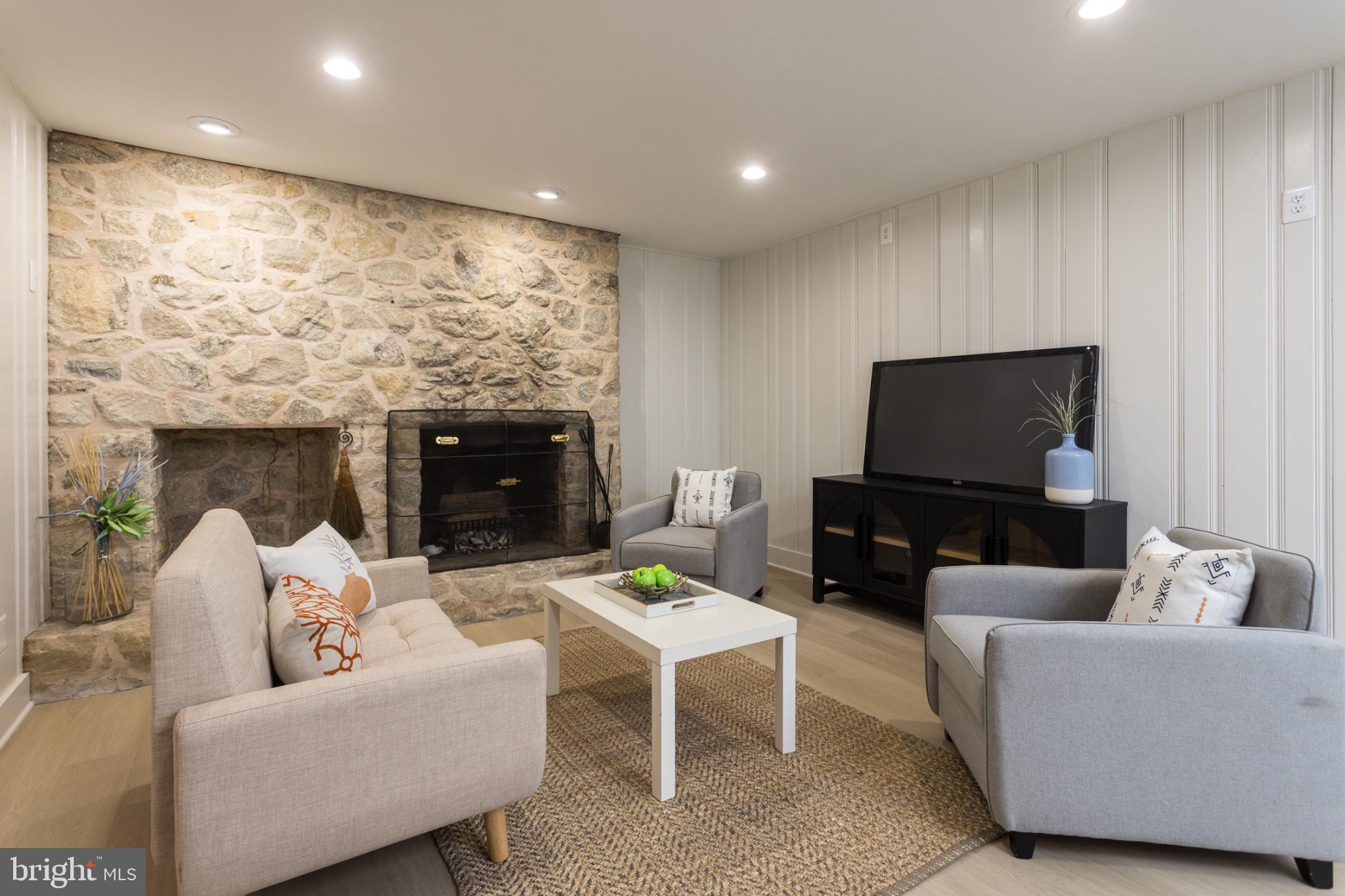 412 Aigburth Road Baltimore, MD 21286 - Photo 22 of 32 Cozy living space with stone fireplace.