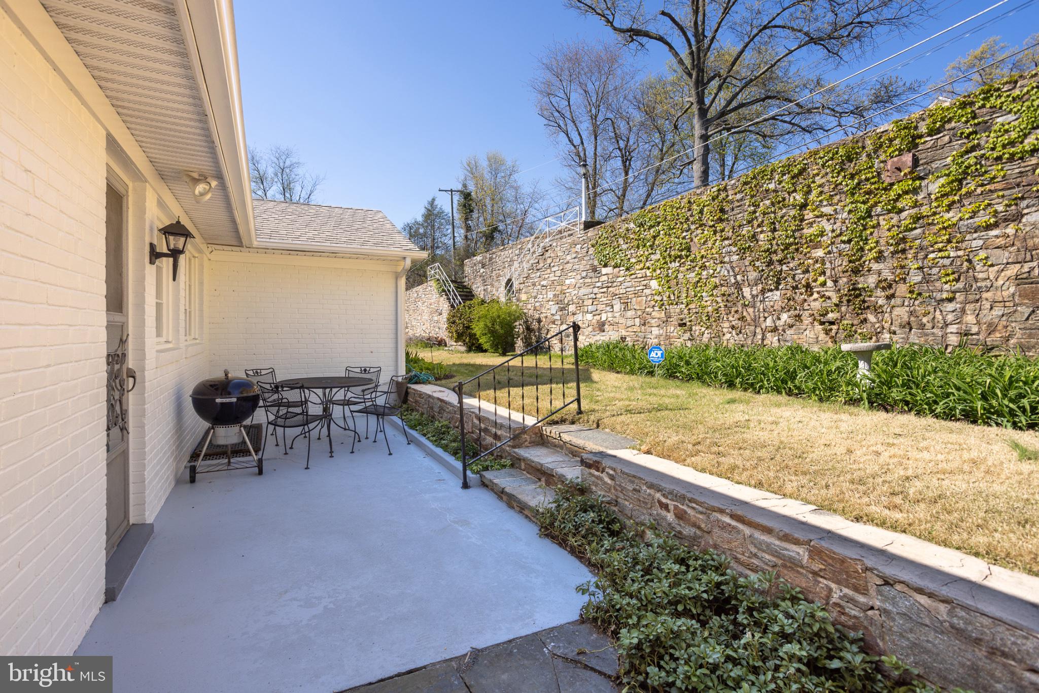 412 Aigburth Road Baltimore, MD 21286 - Photo 25 of 32 Charming patio with stone wall backdrop.