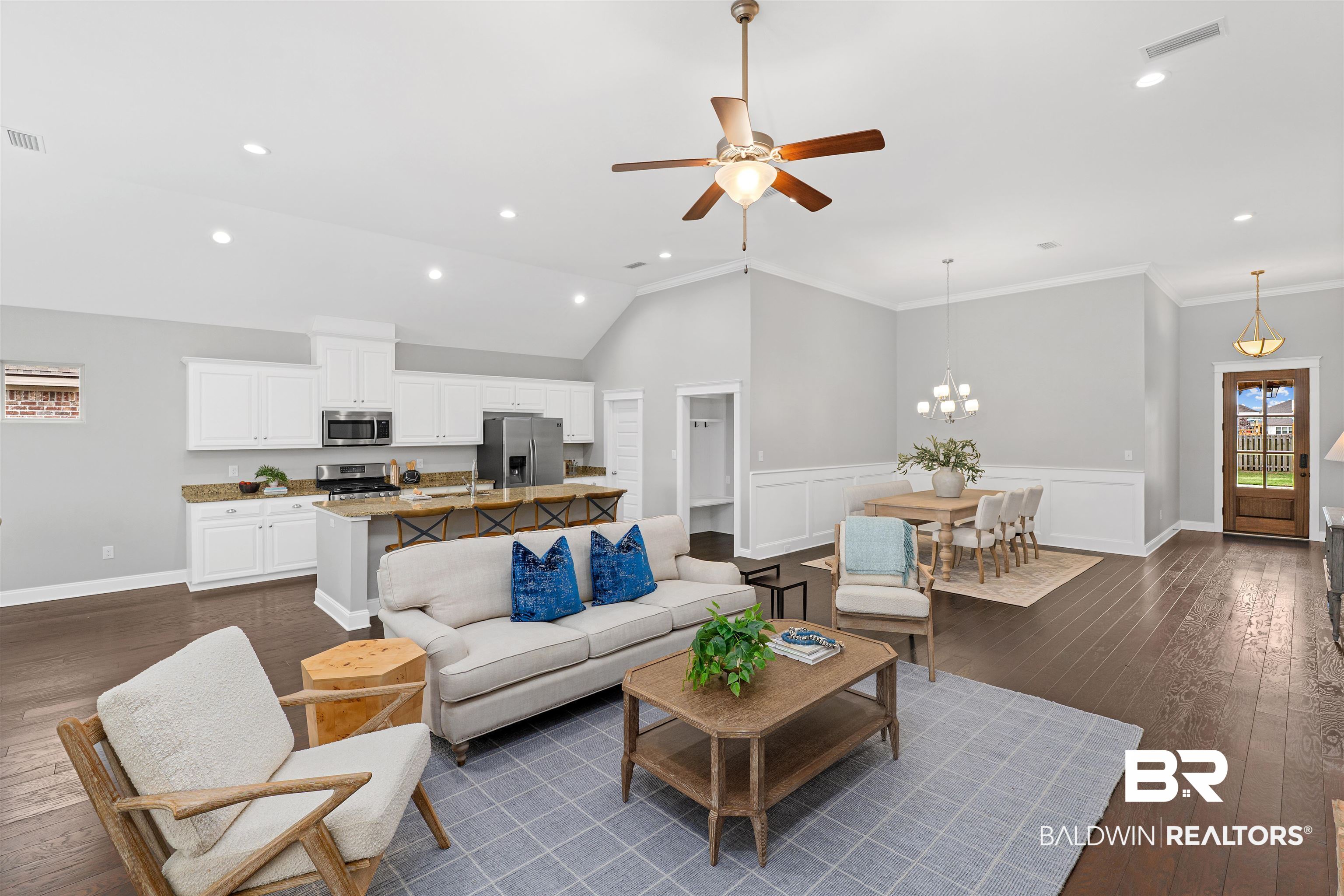24838 Slater Mill Road Daphne, AL 36526 - Photo 8 of 46 Living area featuring dark wood-style flooring, ceiling fan, wainscoting, recessed lighting, and a chandelier