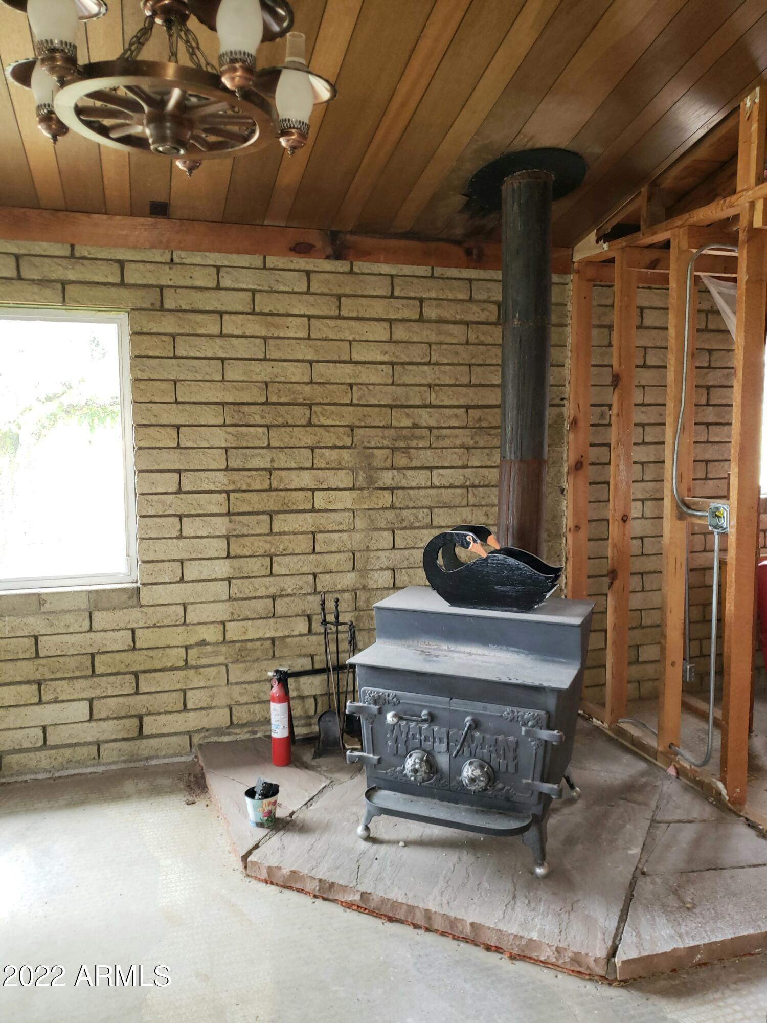 306 Rolling Hills Road Young, AZ 85554 - Photo 8 of 42 Great Rm wood burning stove