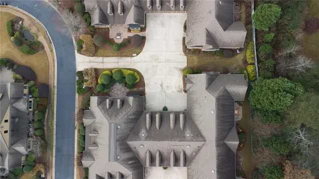 an aerial view of houses with outdoor space