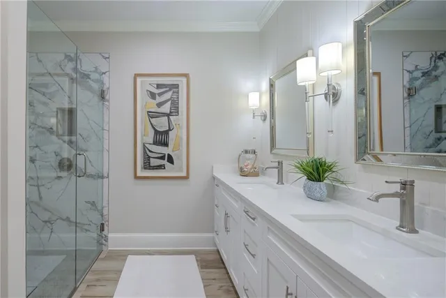 a bathroom with a double vanity sink and a mirror