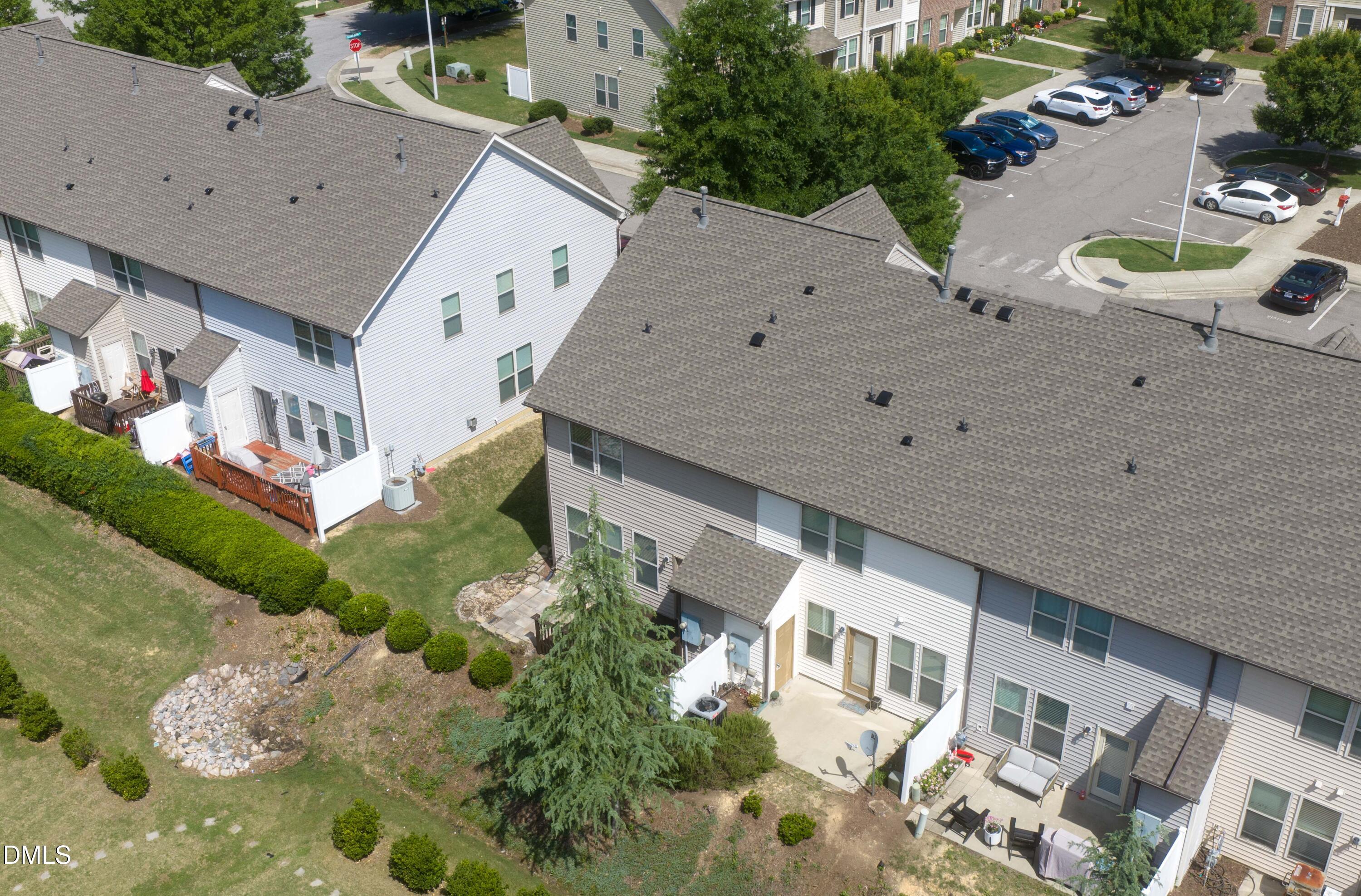 4400 Hillsgrove Road Wake Forest, NC 27587 - Photo 43 of 49 a aerial view of a house with a yard and potted plants